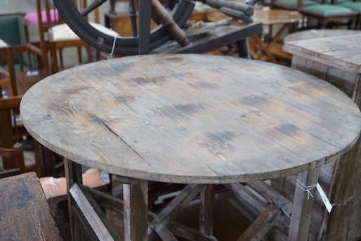 A French provincial pine circular table on folding underframe, diameter 77cm, height 72cm